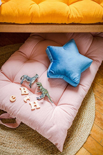 velvet star cushion by Bettys home on floor mat 