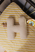 Boucle Letter cushion H by Bettys Home Teddy Letter Pillow lying in kids crib as kids room decoration