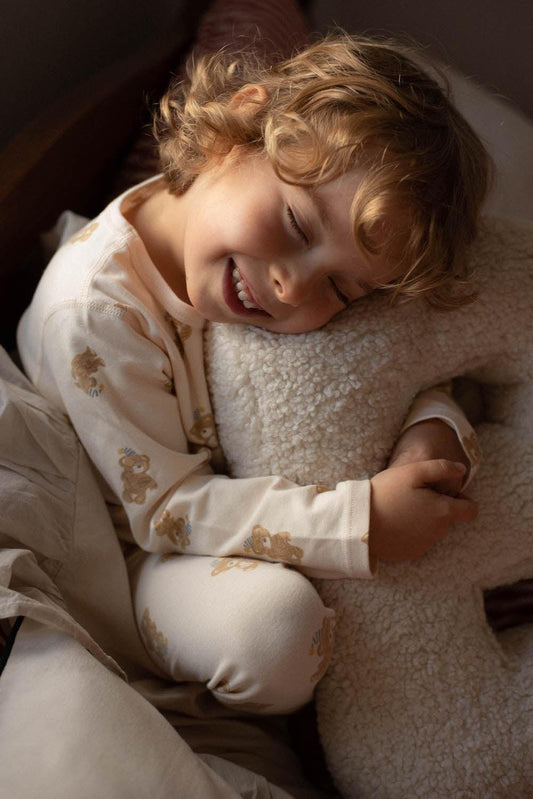 cute little boy hugging Boucle letter cushion B teddy pillow by bettys home kids room deco idea