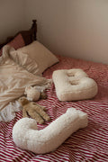 boucle letter cushion B and J teddy pillow by bettys home lying on bed as kids bedroom decoration