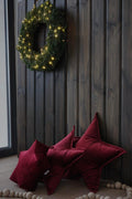 velvet star cushion wine red by bettys home with small star cushion in wine red on wooden wall