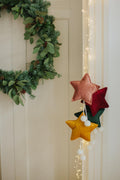 velvet little star pendant yellow with pompoms by bettys home few stars pendant hanging on door 