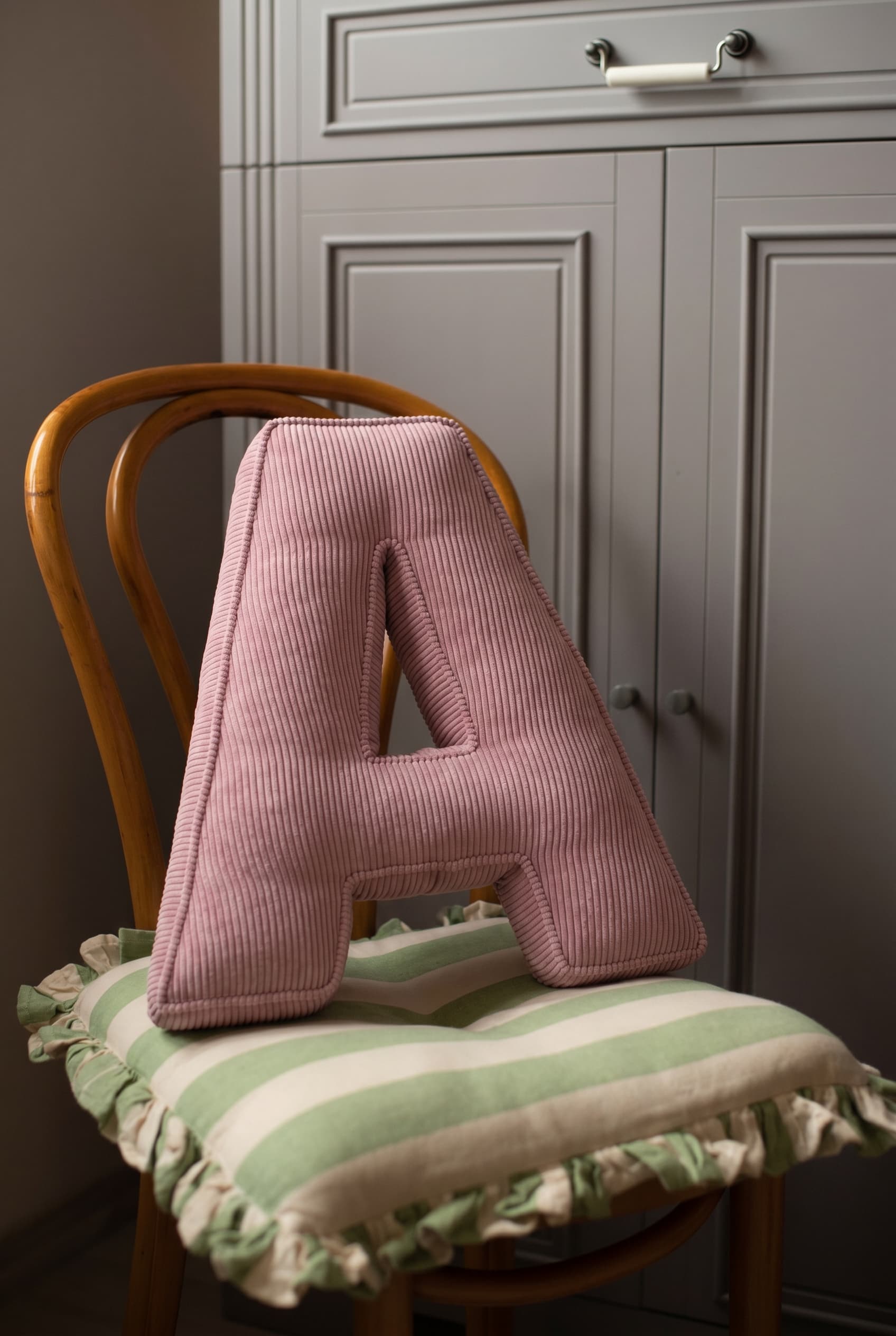 corduroy letter cushion A by bettys home in kids room. Cushion in shape of letter A on chair