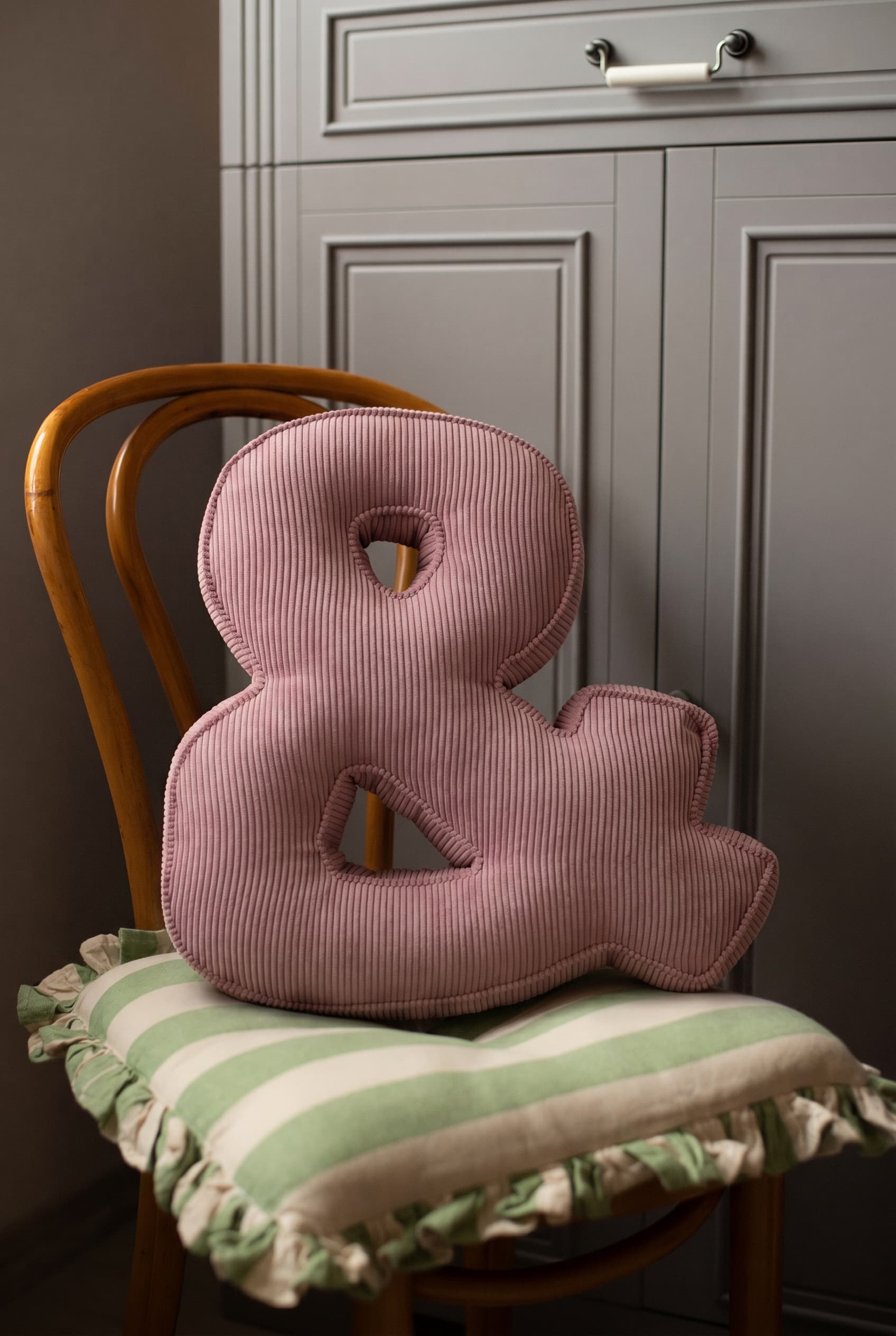 corduroy letter cushion & by bettys home in kids room on chair. Cushion in shape of letter