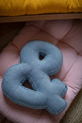 corduroy letter cushion & by bettys home in kids room on mattress. Cushion in shape of letter