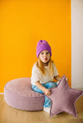 child sitting on large corduroy floor pouf lavender by Bettys home 