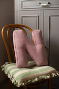 corduroy letter cushion N by bettys home in kids room on chair. Cushion in shape of letter