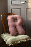 corduroy letter cushion R by bettys home in kids room on chair. Cushion in shape of letter