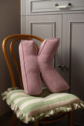corduroy letter cushion K by bettys home in kids room on chair. Cushion in shape of letter