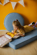 large corduroy floor pouf blue and mattress by Bettys home. Girl on corduroy mattress