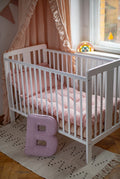 corduroy letter cushion B by bettys home in kids room. Cushion in shape of letter B next to kids crib