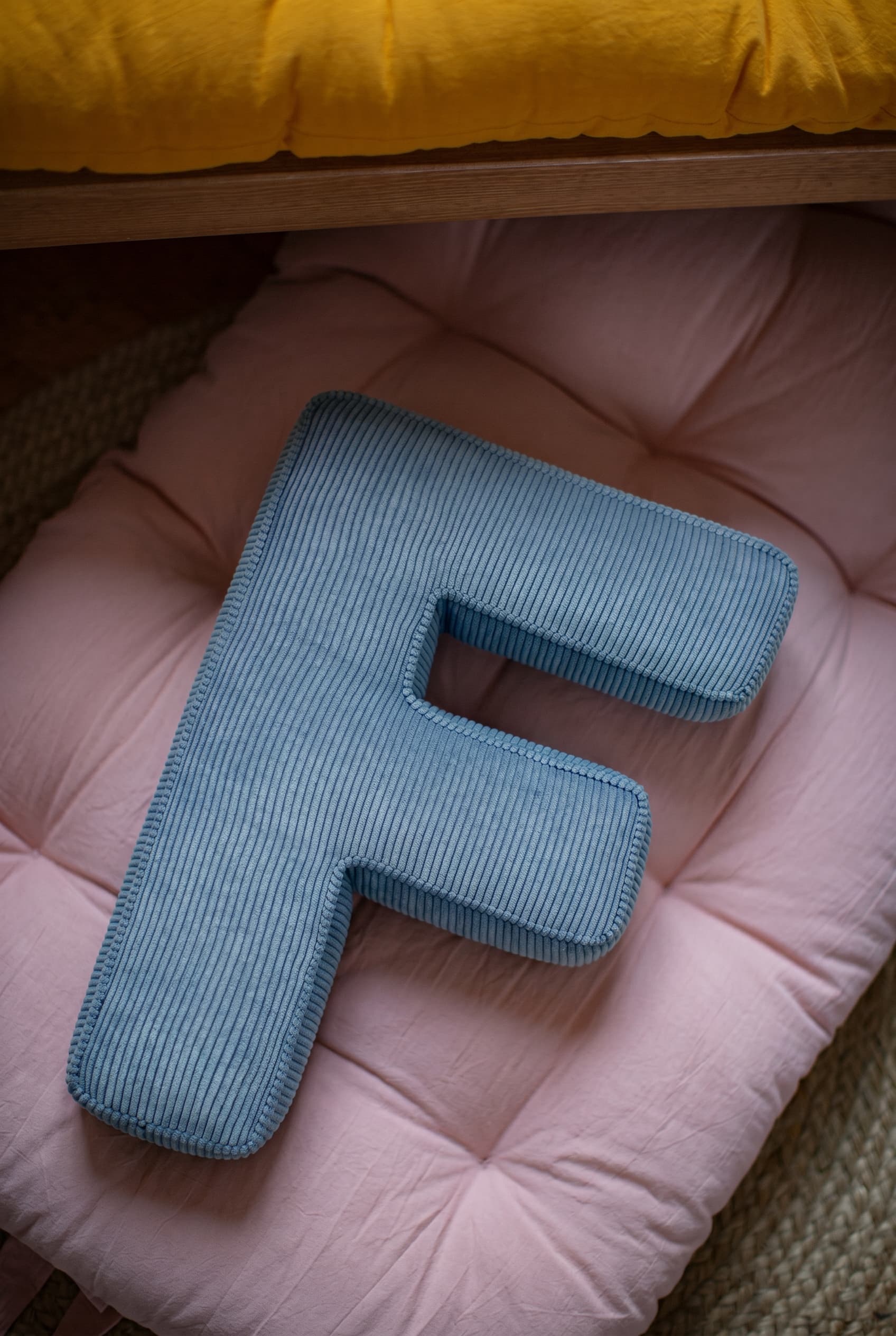 corduroy letter cushion F by bettys home in kids room on cotton mattress 