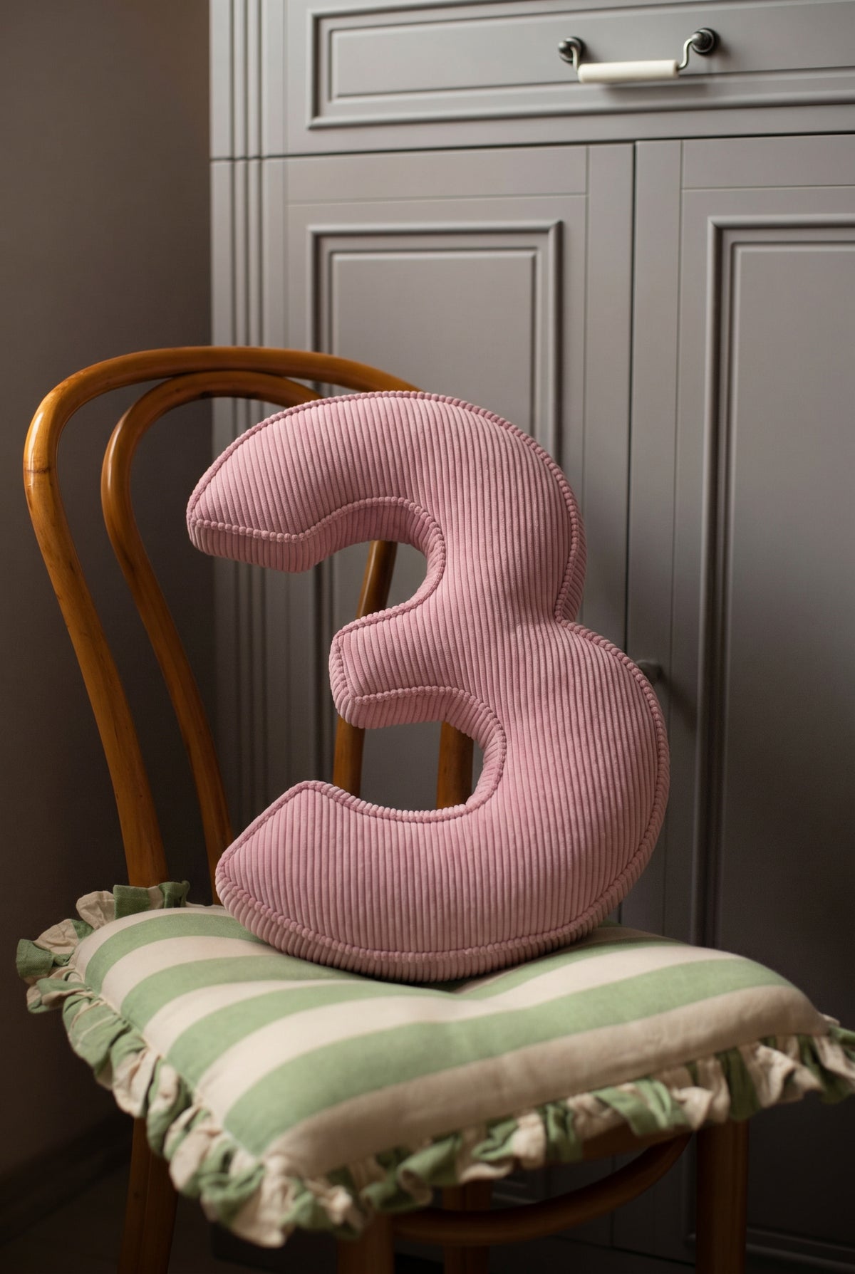 Corduroy Number Cushion by Bettys Home on chair