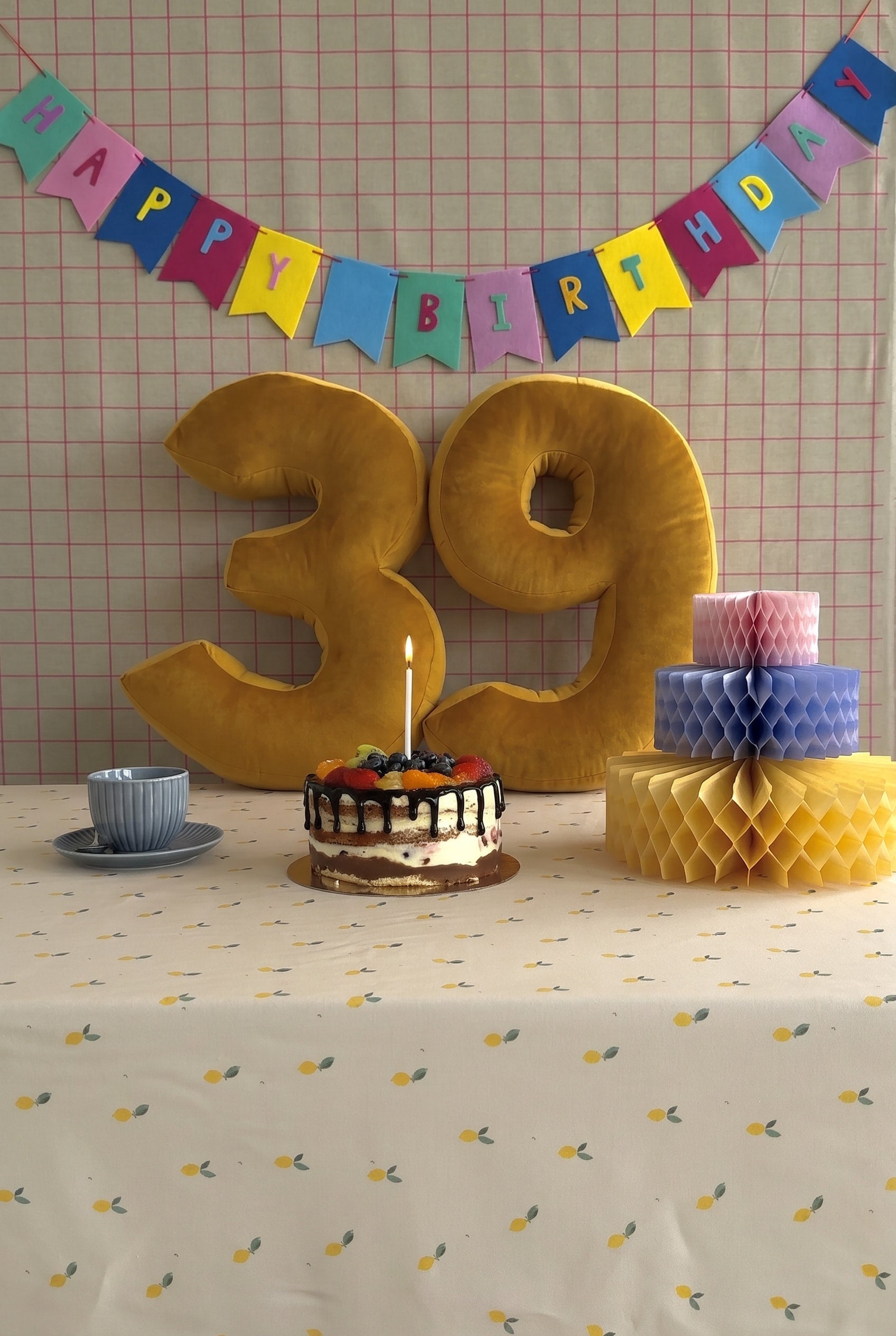 Velvet Number Cushion by Bettys Home on birthday table with cake