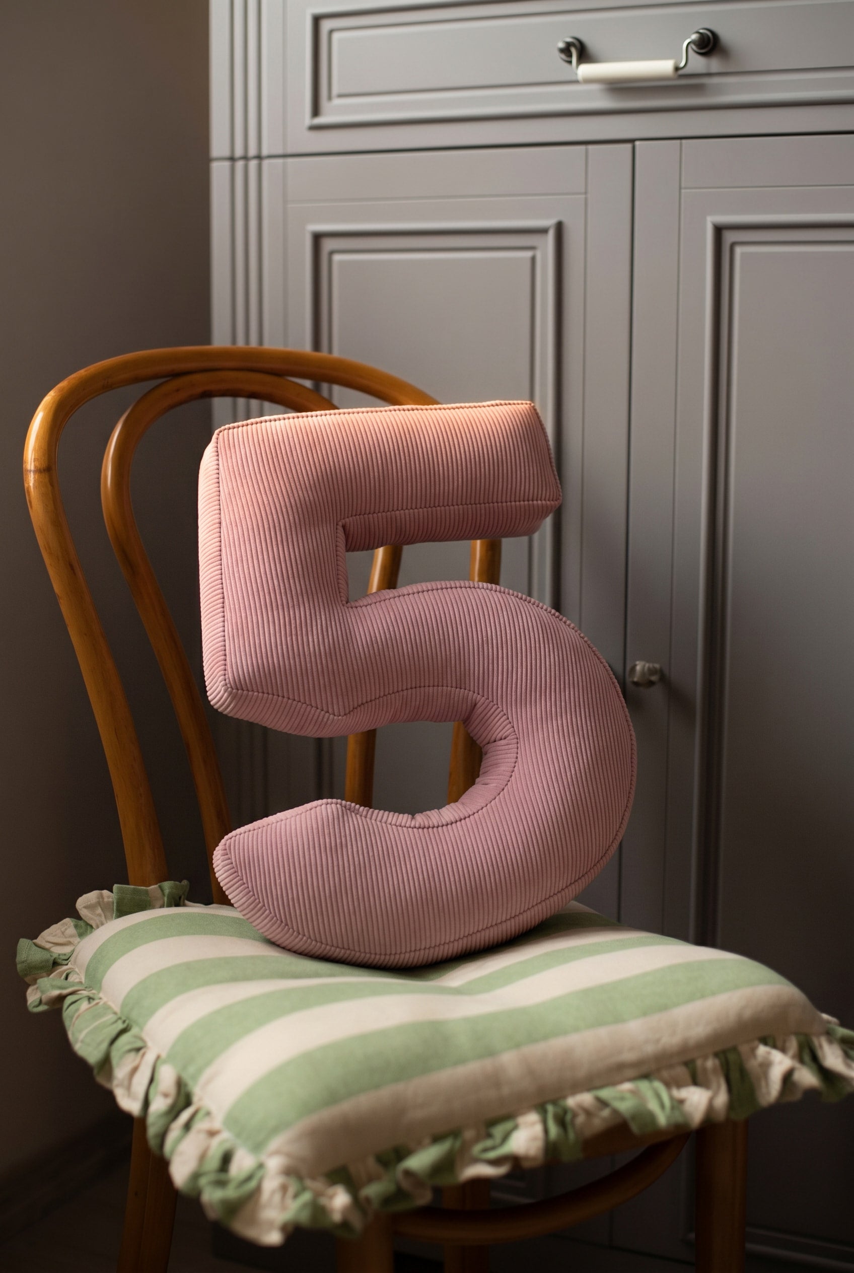 Corduroy Number Cushion by Bettys Home on chair
