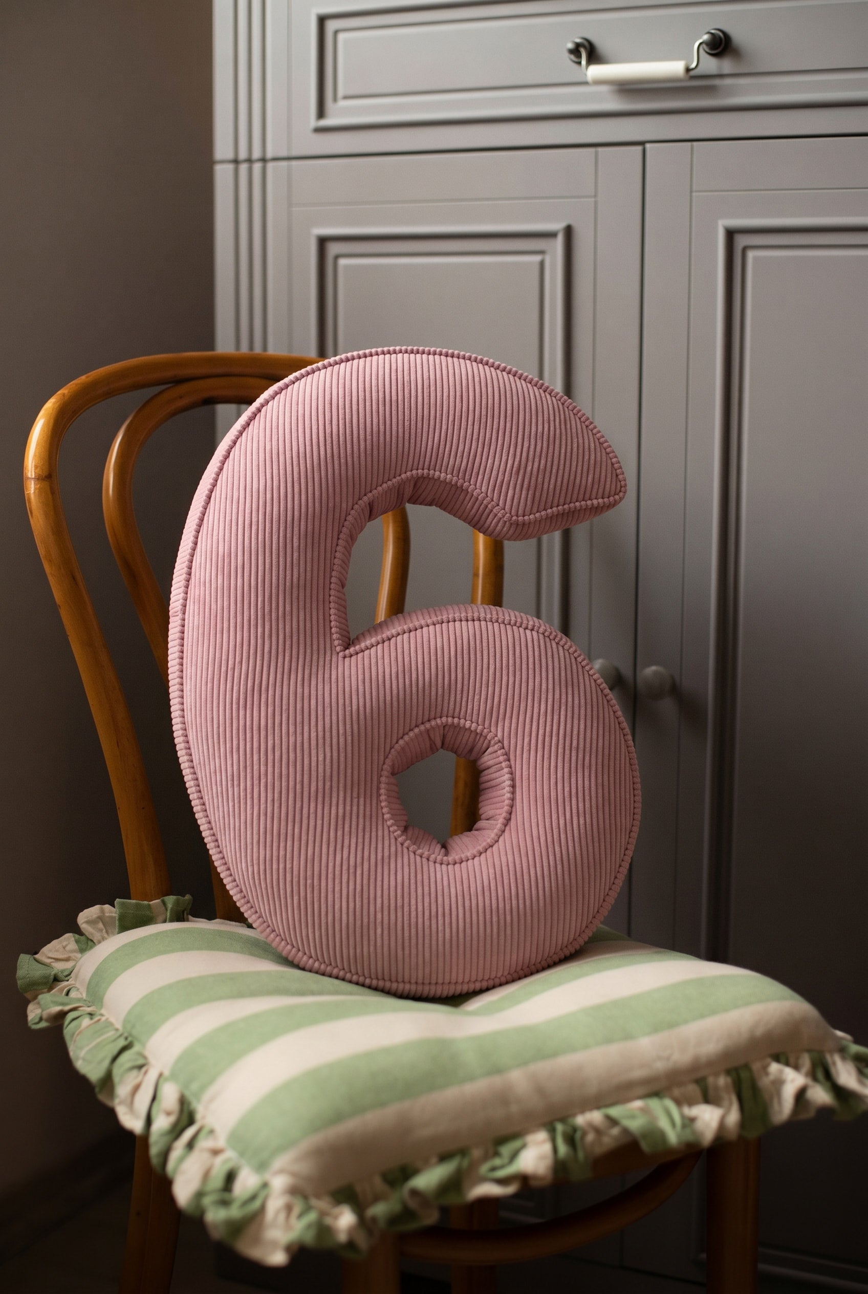 Corduroy Number Cushion by Bettys Home on chair