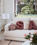 velvet letters cushion S and A in living room on creme sofa. Letter cushions by bettys home
